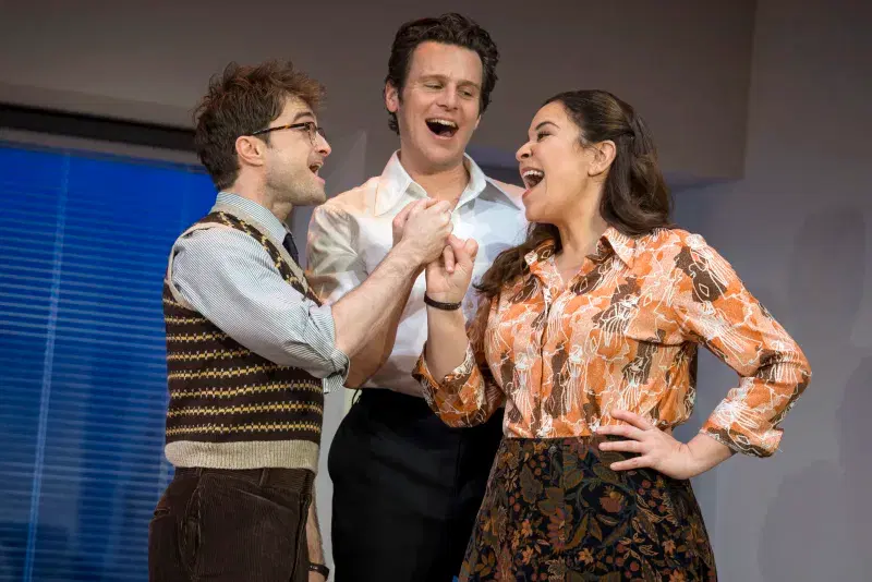 Merrily We Roll Along actors on stage